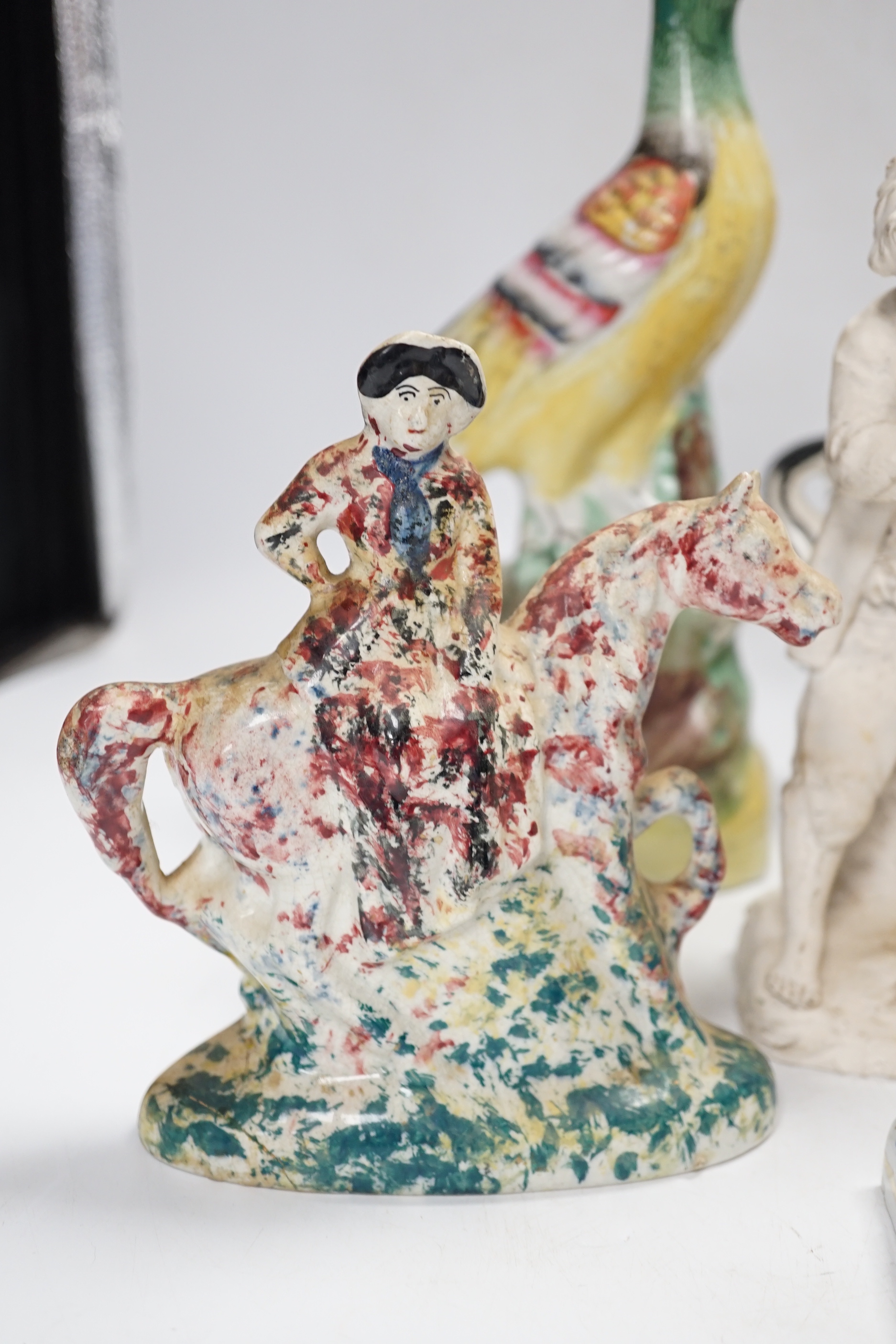 A Staffordshire spongeware rider on horseback, a Staffordshire pheasant, and three other items, pheasant 26cm